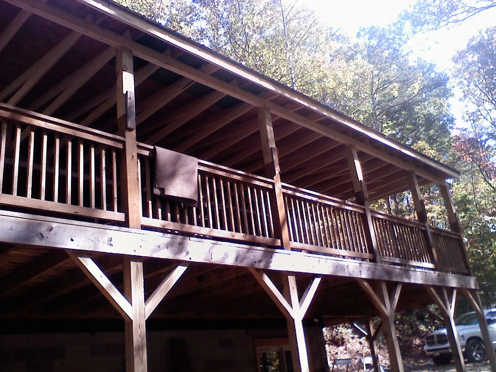 Timber framing under a new elevated porch and deck — Roof Leak Repair in Campaign by Roofing Brothers